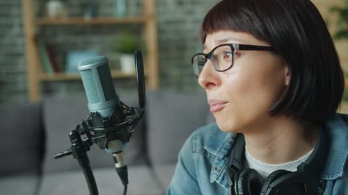 Woman Recording Voiceover in Home Studio