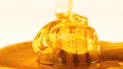 Close Up of Pouring Golden Honey