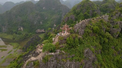 Aerial Shot of the Small Temple and a Dragon on the Top of Marble Mountain Mua Cave Mountain in Ninh