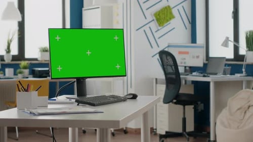 Empty Office with Green Screen on Computer Display