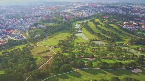 Drone Flies Slowly Over Beautiful Park with Quiet Green Lakes