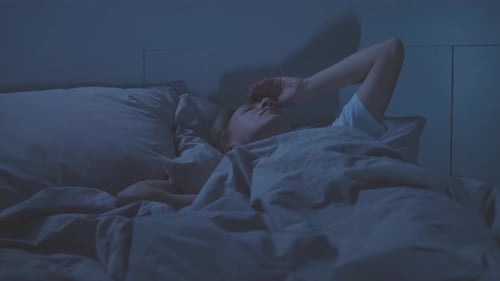 Woman Wakes Up Suddenly in Bed Late at Night