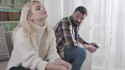 Couple Talking and Arguing on Couch