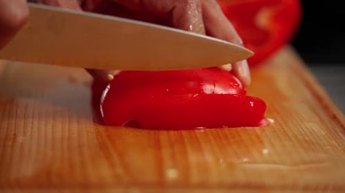 Slicing Red Bell Pepper on Cutting Board
