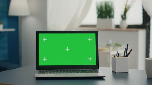 Laptop Computer with Mock Up Green Screen Chroma Key Standing on Home Office