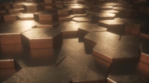 Loopable geometric golden surface cyclically moves in dark background.