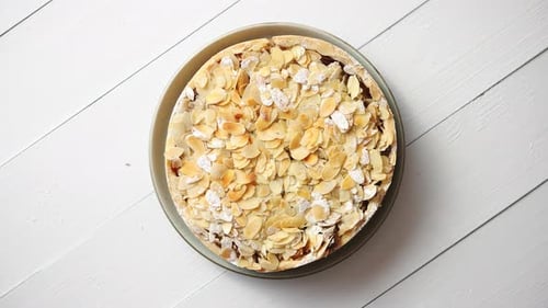 Freshly Baked Homemade Apple Pie with Almond Flakes Cake on Yellow