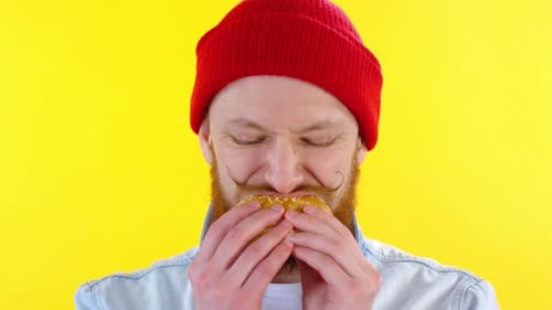 Face of Bearded Man Eating Sandwich