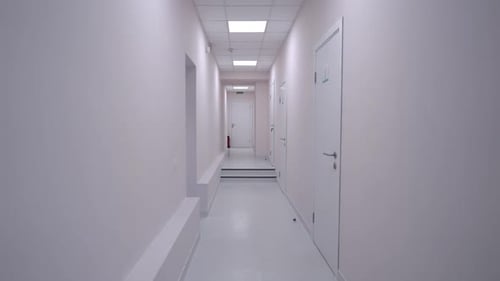 Panning Shot of White Medical Clinic Hallway with No People