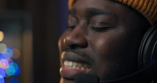 Man with Headphones and Knit Cap Close Up