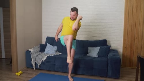 Man Doing High Knee Exercises at Home