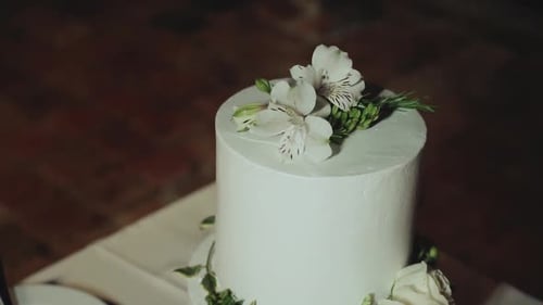 Elegant White Wedding Cake with Floral Decorations