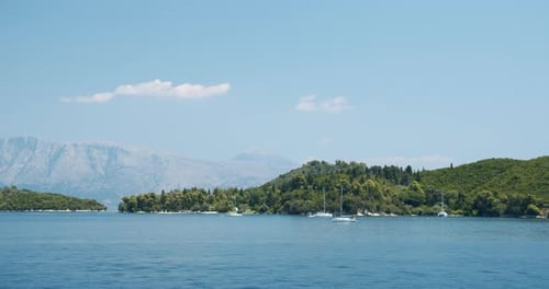 Luxury Yacht Sailing Boat at Anchor Moored in Beautiful Bay Close to Mediterranean Island