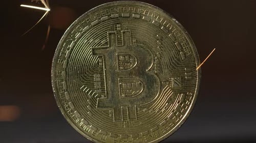 Cryptocurrency on the block chain - close up of bitcoin altcoin physical coins in dynamic setting