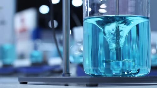 Blue Fluid Being Mixed in Beaker