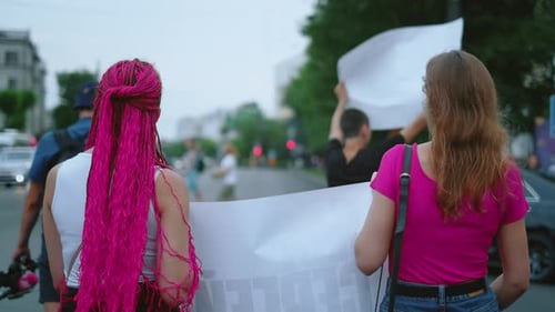 Women Holding Banner at City Demonstration