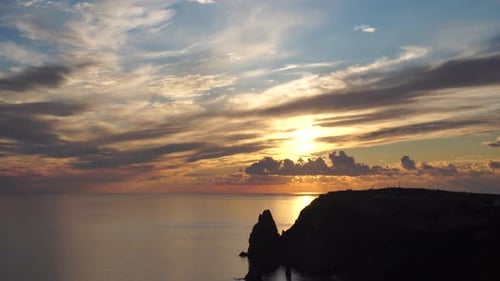 Sea Landscape with Rocky Coastline on Sunset Time