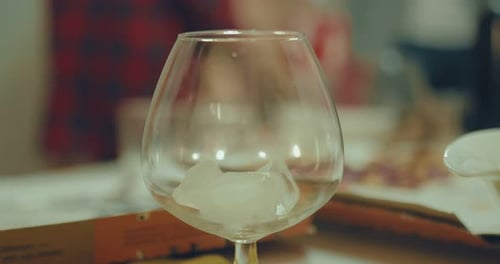 Ice and a Fizzy Drink Poured into a Glass