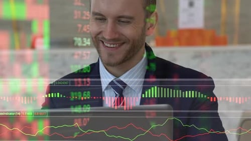 usinessman happiness at desk with laptop in lobby space office background with stock chart market