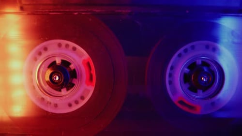 Rotating Audio Cassettes with Red and Blue Lighting
