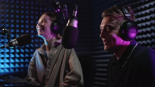 Man and Woman Podcasting in Soundproofed Studio