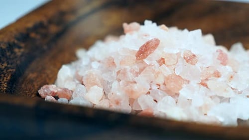 Rotation of raw Himalayan pink salt crystals.