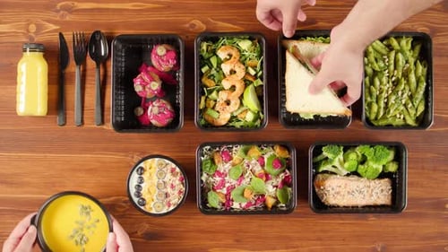 Food Delivery Top View Take Away Meals in Disposable Containers on Wooden Table