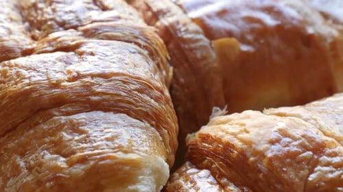 French croissants Vienna-style pastry rolls made of dough slow tilt 4K 2160p 30fps UltraHD footage