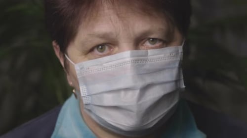 Woman in a Medical Mask. Close-up.