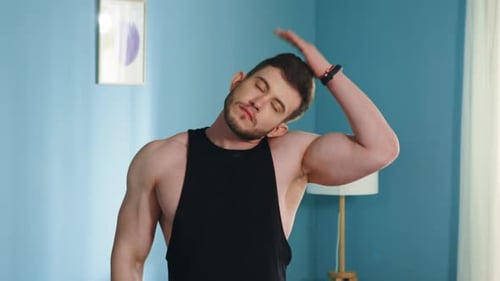 Athletic Man Is Stretching His Neck