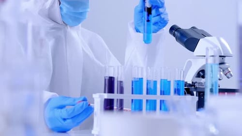 Scientist Working with Test Tubes in a Laboratory