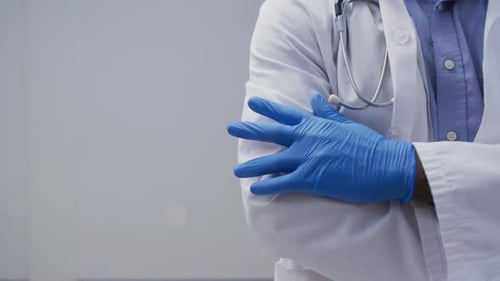 Doctor in Lab Coat with Stethoscope and Gloves