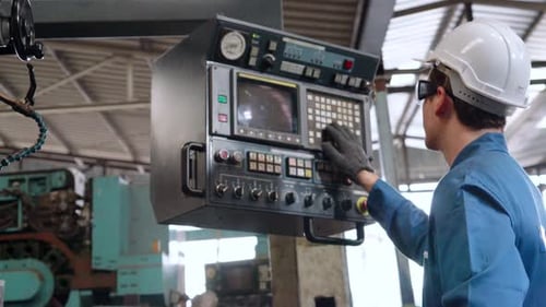 Smart Factory Worker Using Machine in Factory Workshop