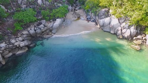 Idyllic Tropical Cove Beach with Turquoise Water Aerial