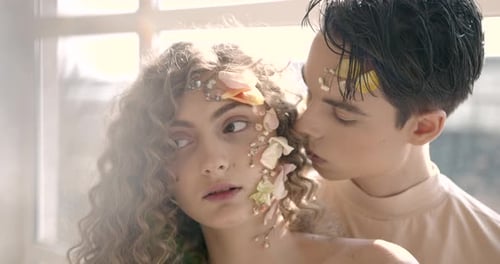 Tendet Young Couple with Floral Make Up Pose in Studio