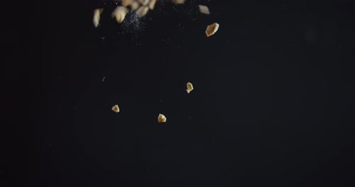 Dropping a Big Pile of Oat Flakes on a Glass Table, View From Under,