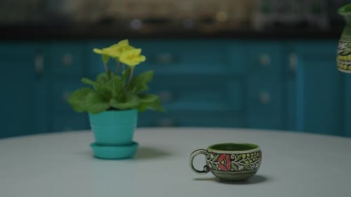 Coffee Pouring into Decorative Cup with Flowers