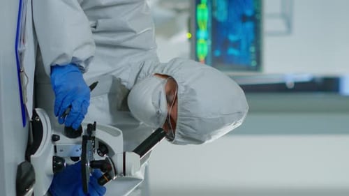 Scientist Working With Microscope in a Modern Laboratory