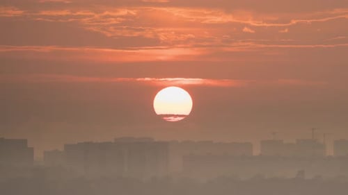 Golden Sunrise over Urban City Skyline