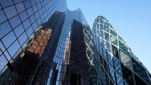 Business district building with wall mirror with blue sky
