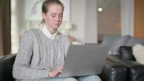 Woman Typing on Laptop Indoors During Daytime