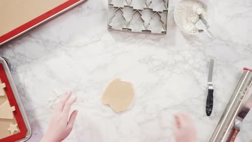 Christmas Cookies Dough Preparation on Marble Countertop