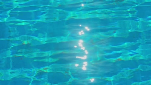 Bright Blue Water Ripple Background in Swimming Pool