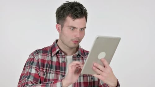 Man Reacting to Tablet Device with Angry Expressions