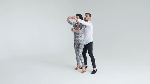 Concept of Love, Relationships and Social Dancing. Young Beautiful Couple Dancing Sensual Dance on a