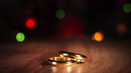 Elegant Golden Wedding Rings with Bokeh Background