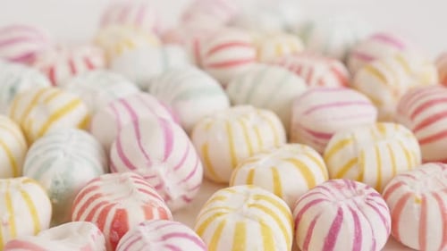 Lot of colorful sugar bonbons close-up 4K tilting video
