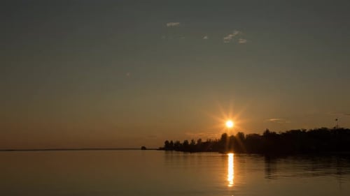Beautiful Sunset By The Bank Of A Calm River, Time Lapse