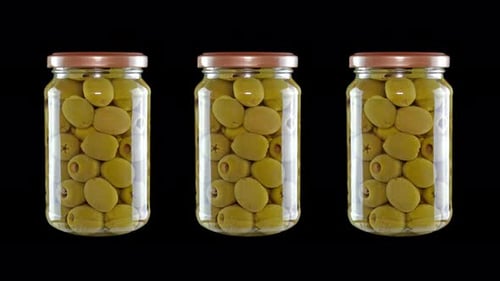 Three Jars of Green Olives on Black