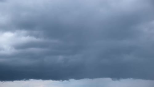 Dark Gray Storm Clouds Swirling Across Sky